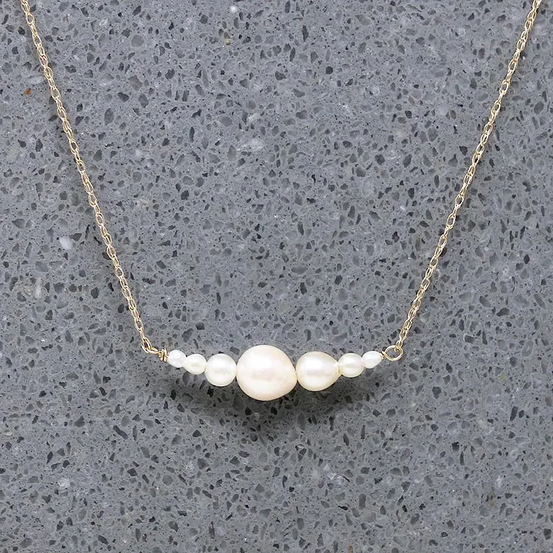 Glowing Pearl & Gold Arc Necklace by brunet