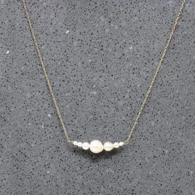 Glowing Pearl & Gold Arc Necklace by brunet