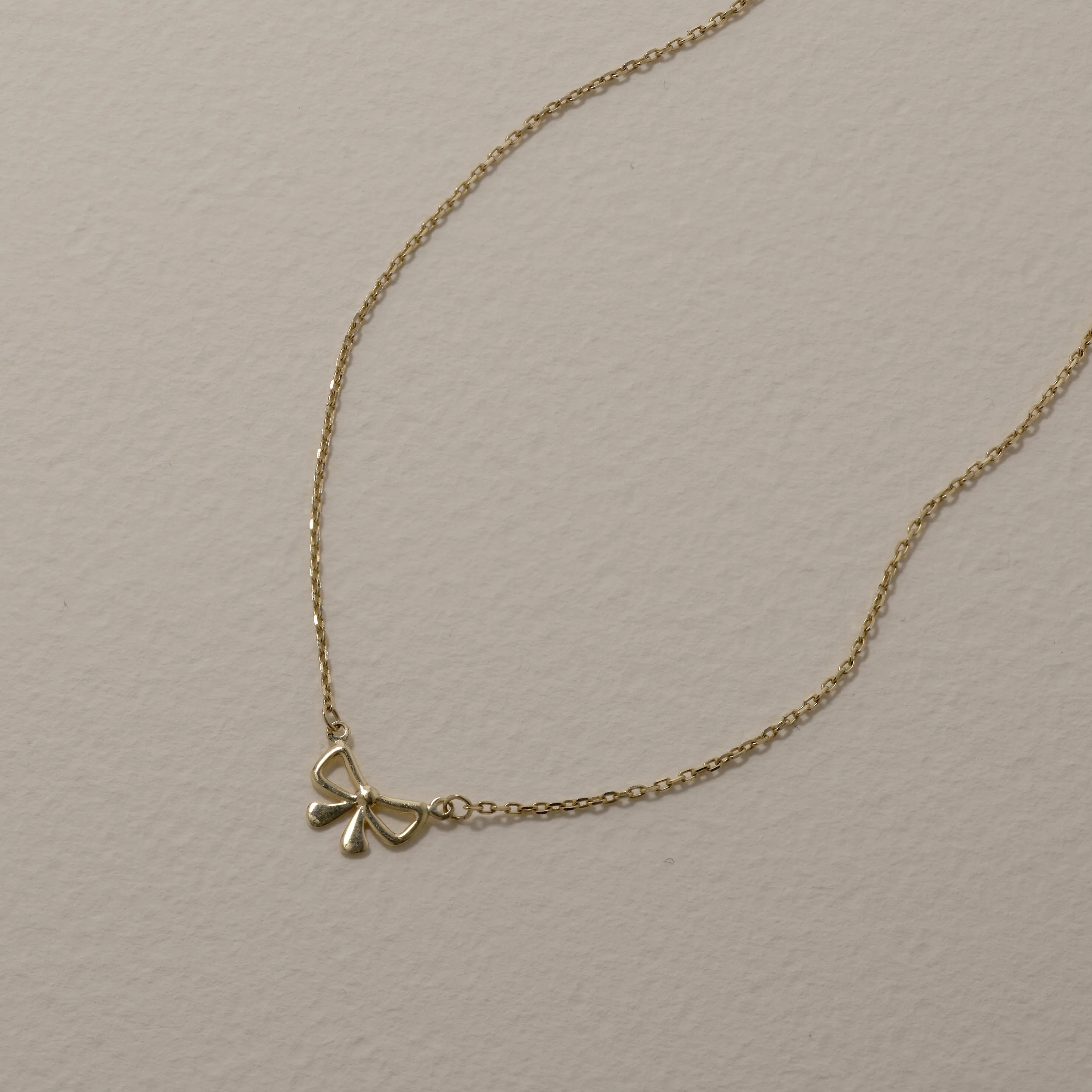 Medley x Dinnara Micro Bow Necklace in 10k Gold